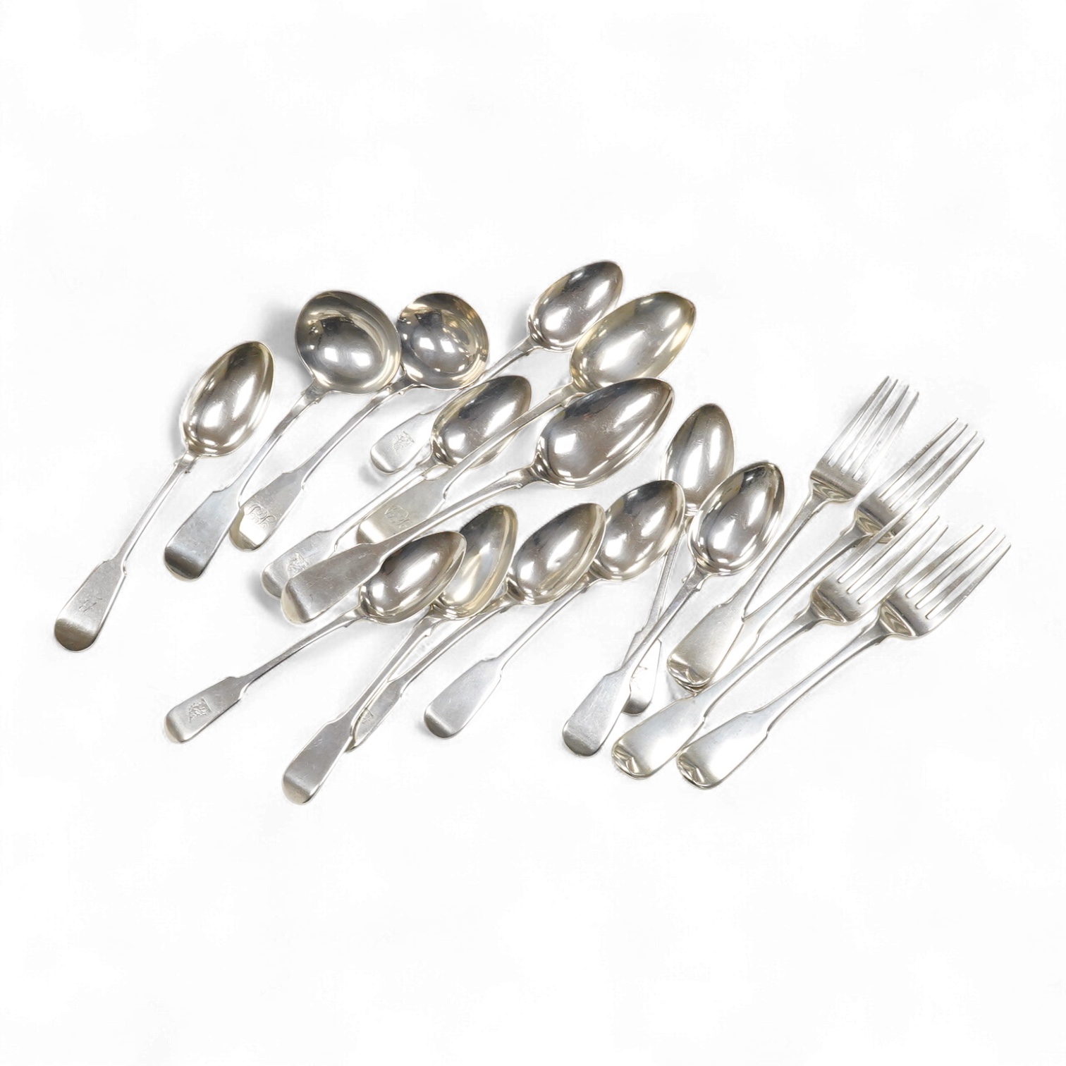 A matched part canteen of 19th century silver fiddle pattern flatware, various dates and makers, including a set of four George III table forks, Eley & Fearn, London, 1807, 28oz, and one plated table spoon.